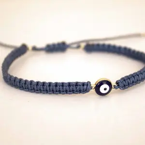 Handwoven Bracelet with Evil Eye Charm - Handcrafted Adjustable Wristband for Everyday Wear