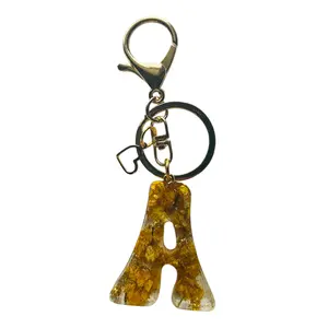 Personalized Floral Resin Keychain Charm with Initials and Gold Clasp - Handcrafted with Vibrant Yellow Flowers for a Unique Gift whimsical accessories