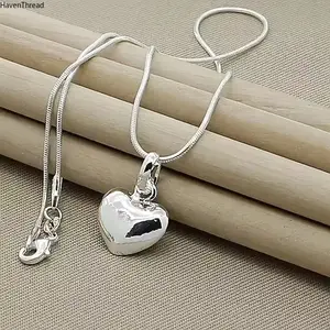 An elegant Silvery heart-shaped pendant necklace with a snake bone chain, suitable for women, a fashionable jewelry gift for weddings SpringStatements
