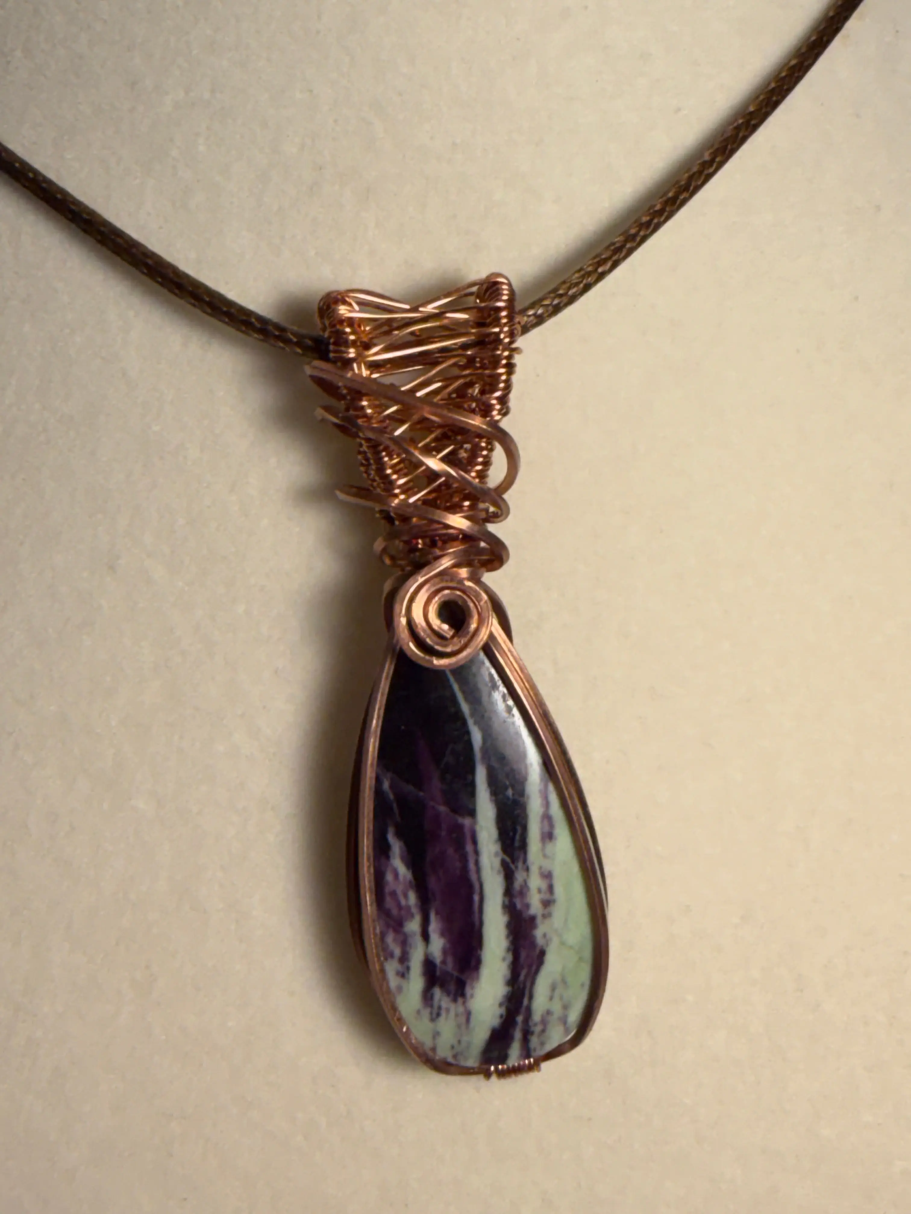 Kammererite copper wire-wrapped pendant