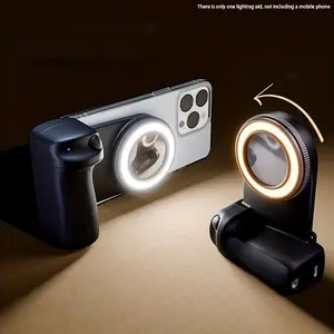 This mobile phone camera grip/light filler is a smart phone camera holder with a magnetic detachable remote shutter, 360° rotating magnet, adjustable brightness (warm or cool light), easy selfies, live streaming, and suitable for outdoor photography.