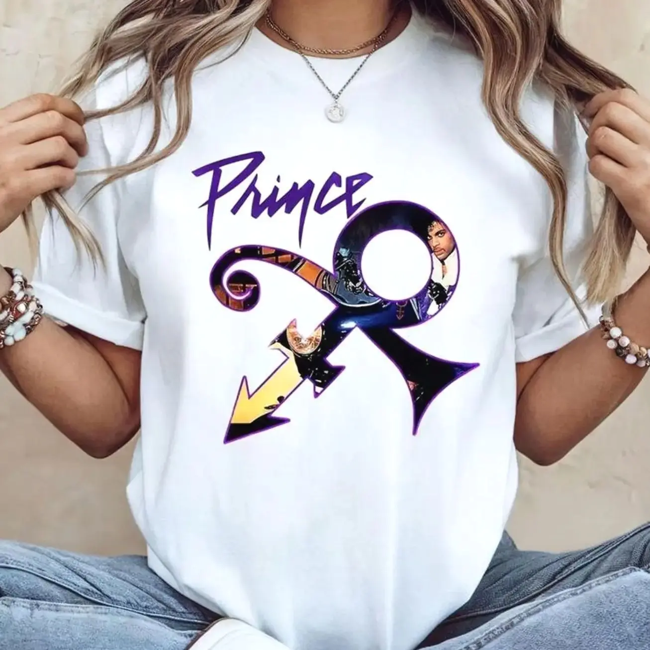 Prince Purple Rain Symbol Graphic T-Shirt, iconic music-inspired design on soft cotton. Unisex streetwear tee, perfect gift for Prince fans.