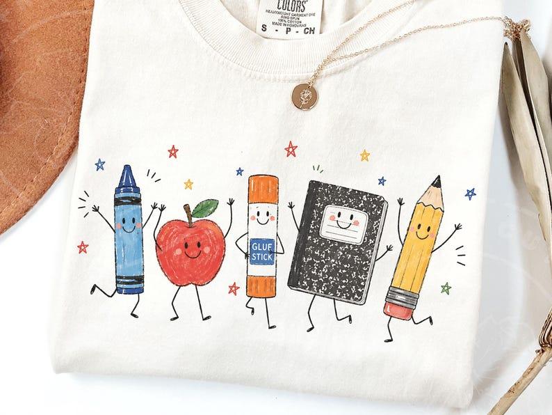 Comfort Colors Cute School Supplies Heritage Graphic Tee, Aesthetic Back To School Spirit Shirt, Radiant Teacher Crayon Apple Pencil Notebook Top, Thoughtful Classroom Sublimation Gift Boutique Heritage Apparel