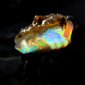 11.8 gram Ethiopian specimen water opal with contra luz rainbow bar flashes and cool inclusions