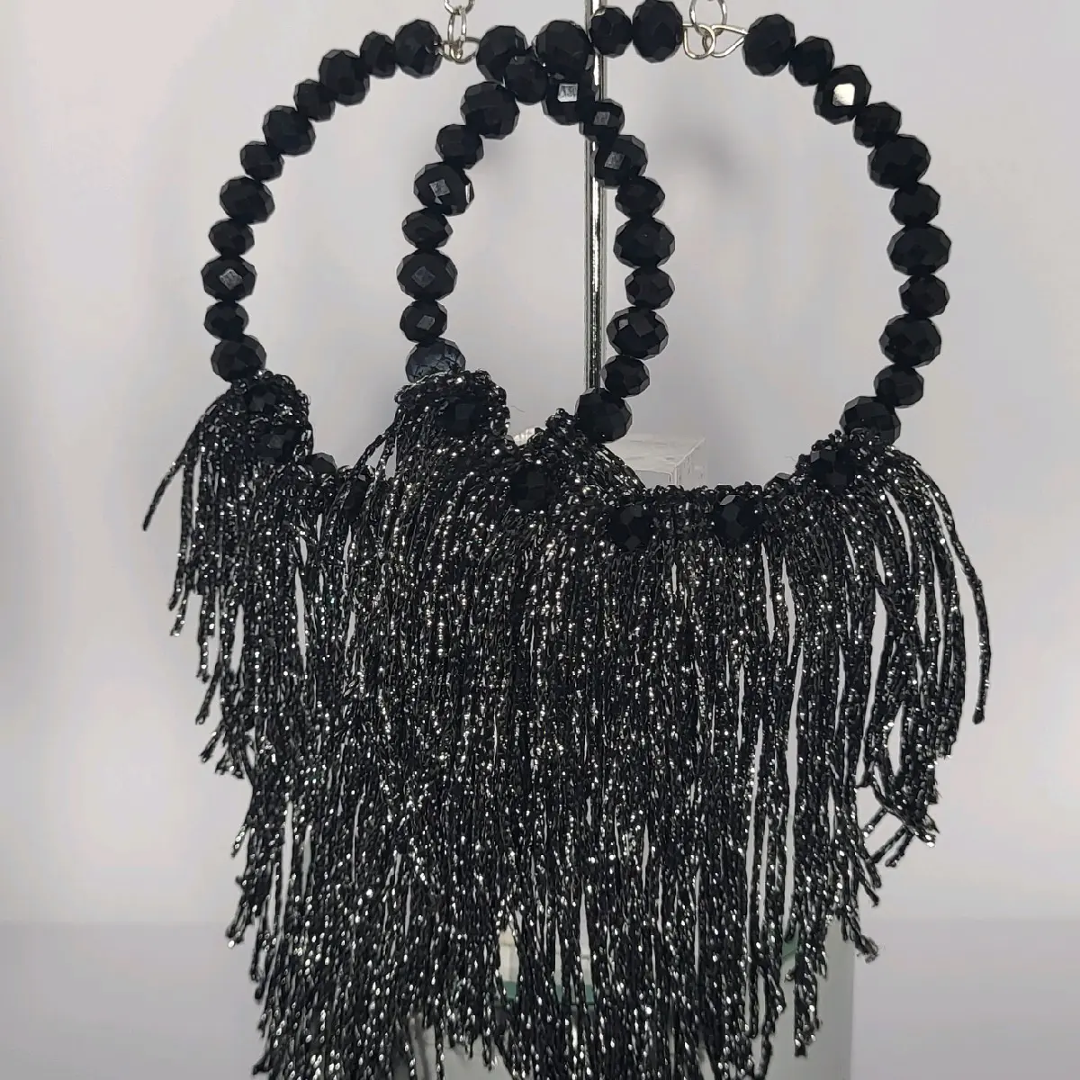 Black Sparkly Crystal Earrings or Tassel Earrings.