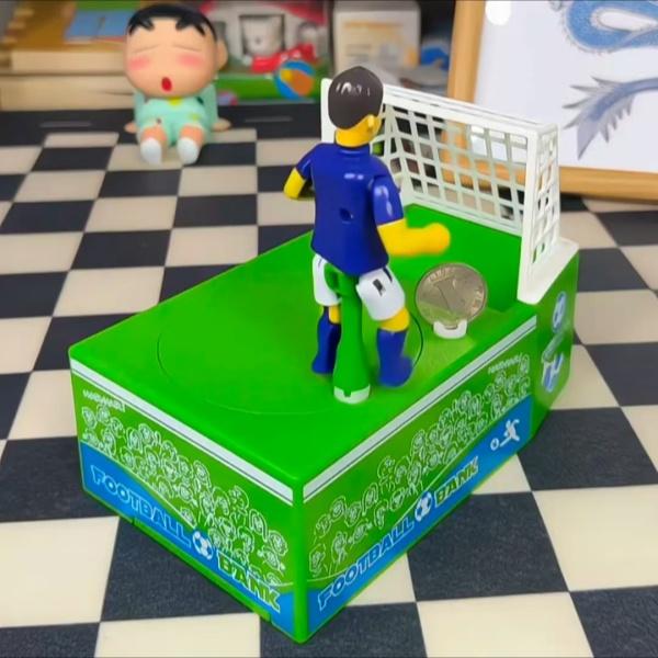 2026 Creative Kicking Soccer Piggy Bank, World Cup Coin Bank, Football-Themed Souvenir Gift, Desktop Decoration, Novel Cartoon Money Bank