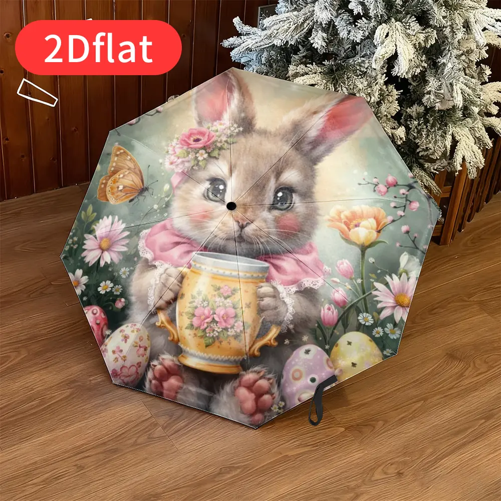 An Easter Bunny Folding Umbrella – featuring an adorable cartoon bunny design with floral patterns and colorful Easter eggs, lightweight and portable for travel and everyday casual use, durable canopy made of sturdy