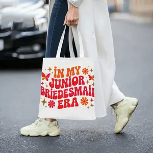 In My Junior Bridesmaid Era Canvas Tote Bag for Flower Girls Junior Bridesmaids Wedding Party Gift Cute Butterfly Floral Star Printed Reusable Shoulder Bag for Wedding Ceremony Bridal Shower Party Fav