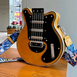 Vintage Inspired Guitar Shaped Cross Body Bag With Adjustable Straps Rivet Emblishment.