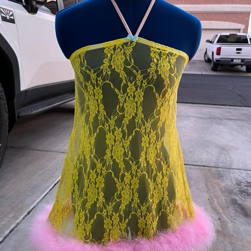 Pink lemonade lace dress with ostrich feathers