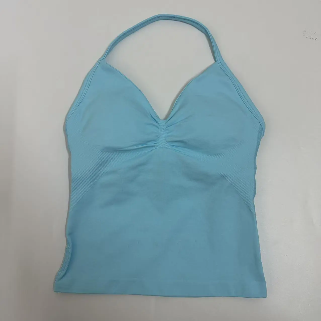 DFYNE Backless Fitness Tank Top with Built-in Bra Pads, Long Straps, and Elongated Cuffs for a Slimming Look, Ideal for Yoga Training. DFYNE Backless Fitness Tank Top with Built-in Bra Pads, Long Straps, and Elongated Cuffs for a Slimming Look, Ideal for Yoga Training.