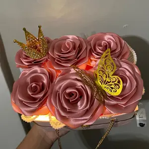 Elegant Pink Satin Rose Clutch with Gold Crown and Butterfly Accents for Special Occasions