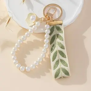 Elegant Leaf Ribbon Pearl Wristlet Keychain - Fashionable Phone Lanyard and Car Key Ring Accessory with Handmade Beaded Design, and Versatile Use