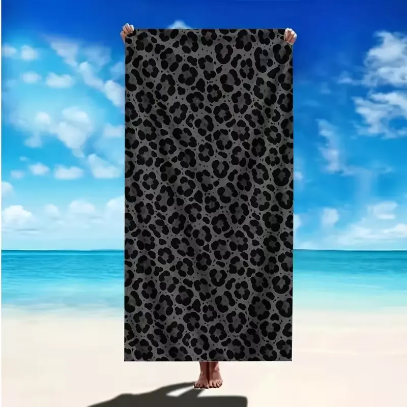 A stylish leopard print beach towel, Lightweight Soft Towel, suitable as a sunbathing mat, a temporary changing shawl, and for moisture-proofing and heat insulation on the beach surface. Lightweight and versatile, it is perfect for seaside travel.
