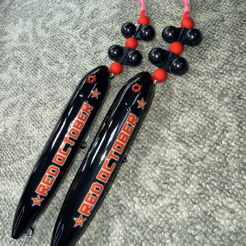 Red October Rig Large (13cm) 2 Pack: Pre-tied subs on 8/0 fluorescent pink hook and 100 pound smoke blue mono leader line