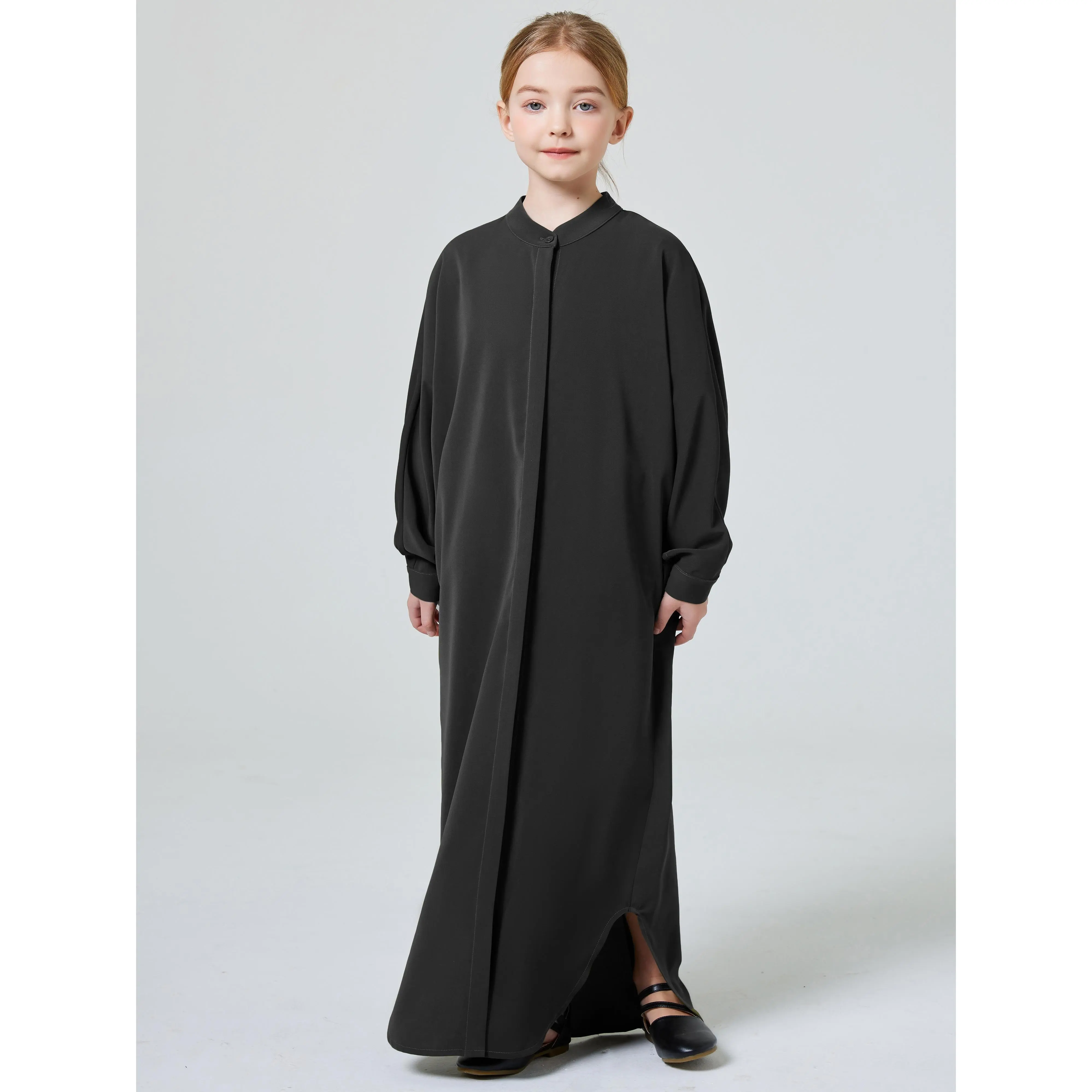 Solid Color Button-Up Abaya with a Small Collar for Muslim Girls During Ramadan in The Middle East.