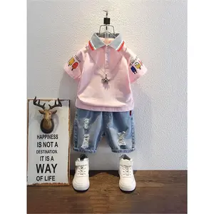 Boys' Summer New Cartoon Print 2pcs Set with Collar Short Sleeve and Distressed Denim Shorts, Perfect for Outdoor