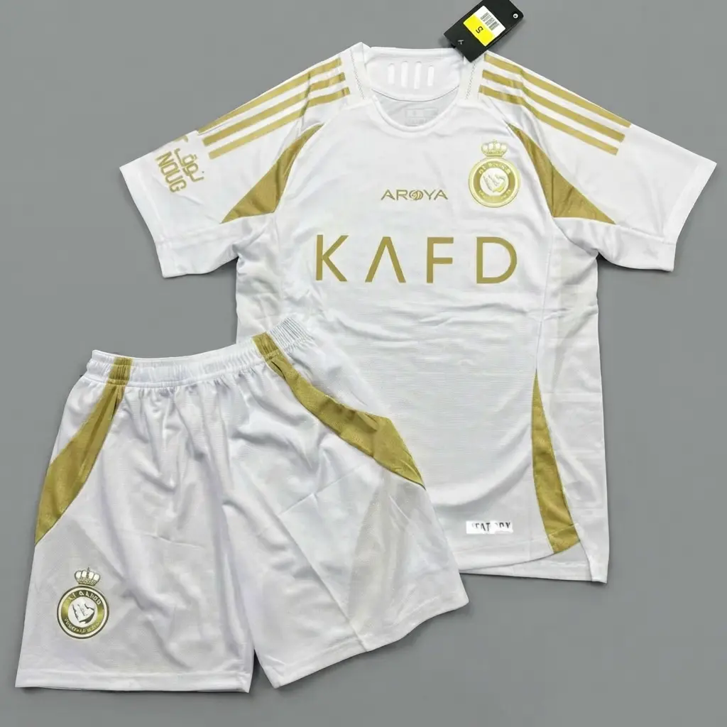 Al Nassr White Gold Soccer Jersey KAFD (Free Matching Shorts Included) Grey Studio Flat Lay Display | Saudi Away Kit Shirt | Matchday Fan Gift Idea