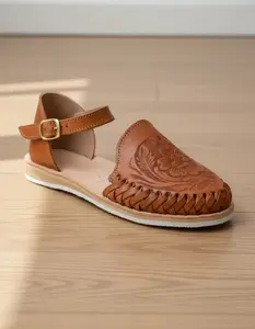 Women's flat huarache-style sandals, handmade from Mexican leather, model 911. Round toe with unique detail and ankle strap. Genuine leather upper. Comfortable. Ethically made in Mexico. Ideal for walking.