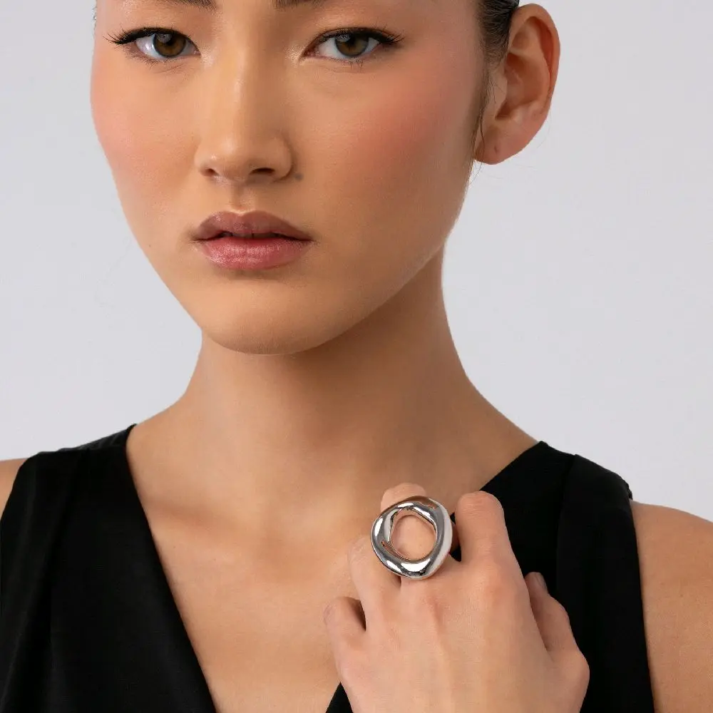 Whirl  Like motion seemingly caught mid-spin, the ring “Whirl” stands out atop the finger in an open, fluid silhouette echoing the effortless energy that inspired its name.  Rhodium Plated  Ring Size  7  8  9  10