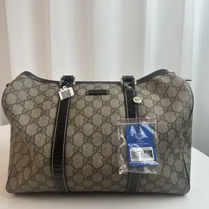 Pre-owned GUCCI canvas Luggage Top Handle Bags