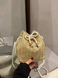 1pc Women's Mini Straw Drawstring Bucket Crossbody Bag, featuring a fresh beach vacation design perfect for seaside trips, daily outings, and summer leisure wear