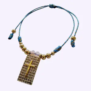 Blue Cord Bracelet with Gold Cross Pendant and Beaded Design for Men and Women
