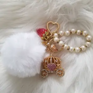 LipsGal Cosmetics LLC Fantasy Ball Keychain with Elegant Pearl Design Gold Heart Charm & Sparkling Carriage Pendant for Stylish Accessories