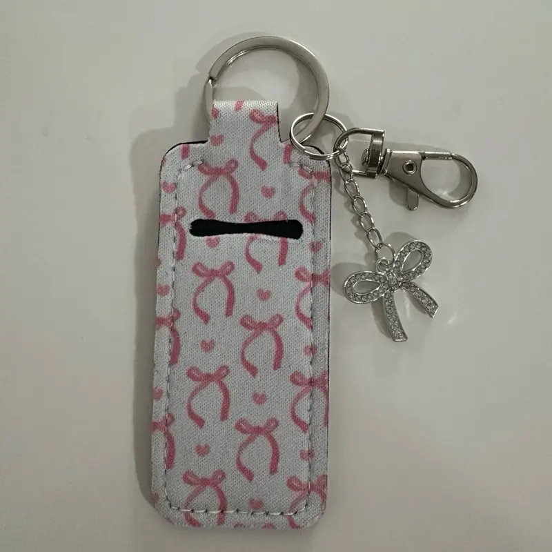 Lip Gloss Keychain with Pink Bow Pattern and Silver Charm Accessory