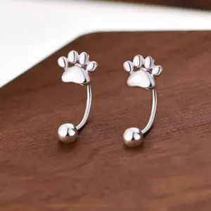 A pair of cat paw hook earrings for women, stylish and delicate, cute and perfect for everyday wear or party outfits.