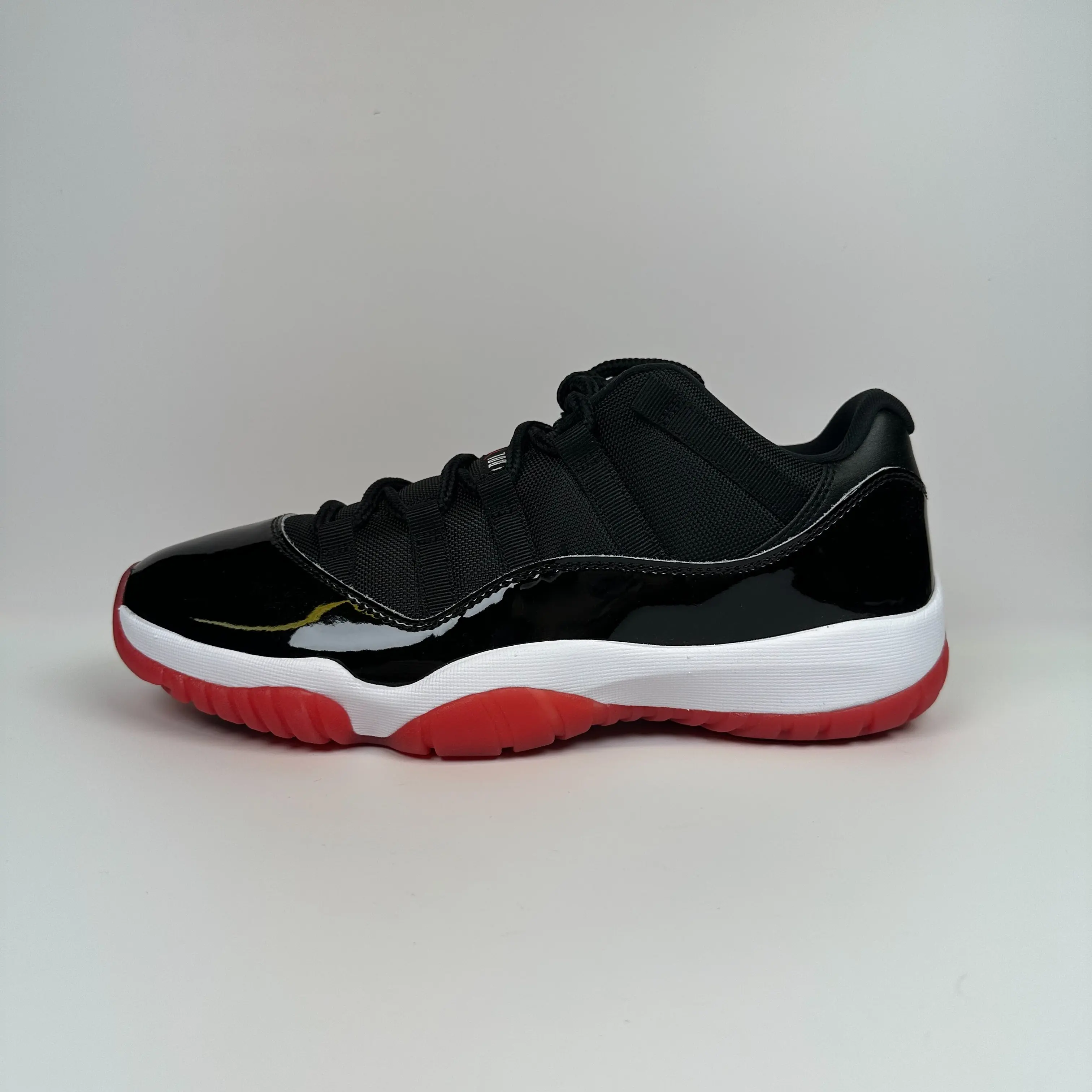 Nike Air Jordan 11 Low Bred 2025 FV5104-006 Patent Leather Black Red White Midsole Sneakers for Collectors & Athletes