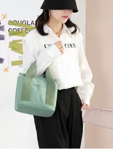 Includes shipping fee. Small zippered bag, layered design, niche minimalist style; can be carried on one shoulder or by hand; thickened canvas; suitable for phones; bucket tote bag.