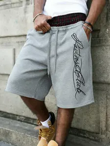 Men's Oversized Grey Sweat Shorts with Red Black Plaid Elastic Waistband, Y2K Layered Streetwear Style, Vertical Signature Script Print, Casual Loose Fit Knee-Length Fleece Shorts for Summer Daily Wear and Hip Hop Fashion