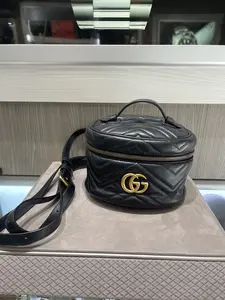 Pre-owned GUCCI Matelassé chevron leather Backpacks Mini GG Marmont Vanity Backpack in Black Matelassé Leather