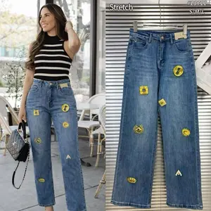 Jeans with Charms - Blue Denim with Yellow Floral Embellishments for a Stylish Look
