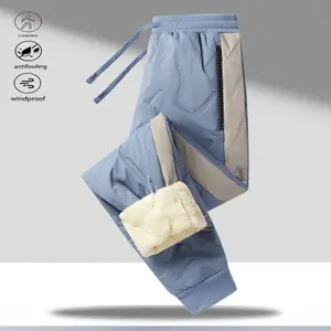 A pair of color blocked wool lined casual pants, suitable for daily wear. Wool design meets the warmth needs of autumn and winter. The drawstring waist is easy to adjust, and the zipper pocket is convenient for storing small items.