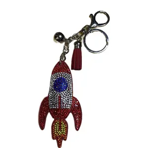 Red Rocket Bag Charm or Keychain with Sparkling Rhinestones and Tassel Accents for Stylish Accessories