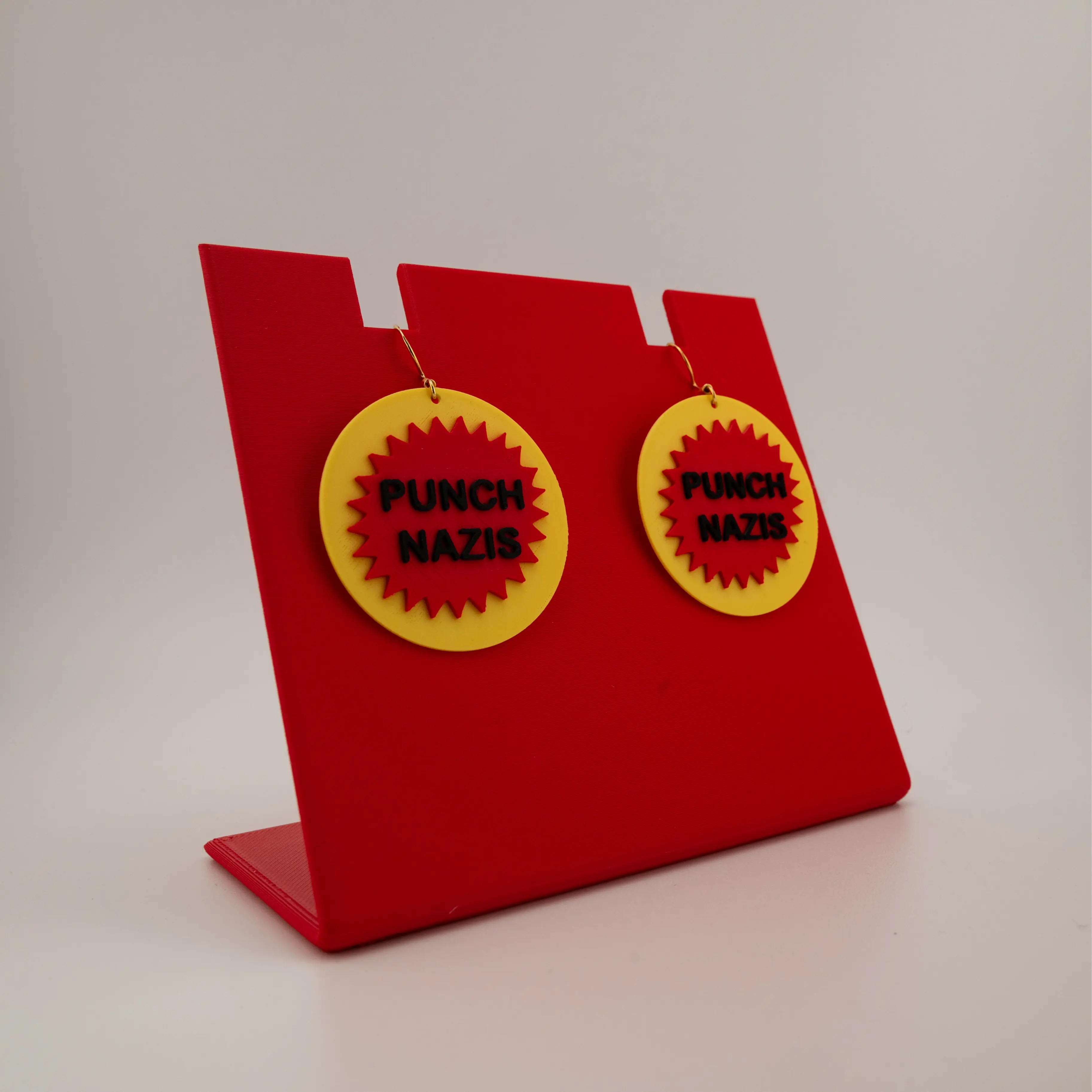 P*nch N*zis Dangle Earrings