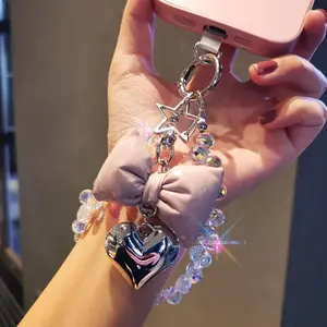 Bow tie love mobile phone pendant ins mobile phone case pendant beaded chain short fashion women's wrist pendant