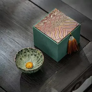 The Dunhuang Lotus Jian Zhan Chinese Gongfu Tea Set with Elegant Green Box and Peacock Design Bowl