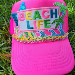 Beach Life foam trucker hat with palm trees and conch shell patches.