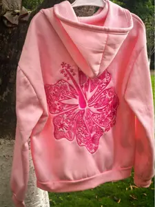 Coastal fashion: vibrant large lotus flower embroidery on the back; hooded sweatshirt made from ultra-soft fleece fabric, featuring a loose, comfortable fit that creates a relaxed beach vibe. A summer essential. Lotus flower embroidery.