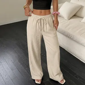 Women’s loose linen pants for couples; woven Lyocell linen solid color breathable straight leg trousers featuring a drawstring and pockets, suitable for everyday outings and outdoor activities.