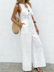 A women's bohemian style Boho white jumpsuit with a design sense of V-neck bow and sleeveless hollow out fashion vacation style wide leg jumpsuit, suitable for summer, home, indoor, and outdoor wear