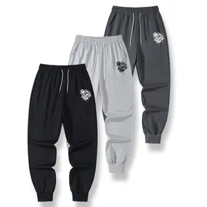 Men's drawstring waist casual pants for spring and autumn, with pockets, printed design, regular fit suitable for everyday casual wear in spring and autumn