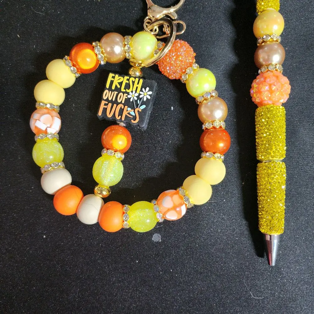 Freshly Handmade Orange and Yellow Beaded Bracelet with 'Fresh Out of Fucks' Charm and Glittery Pen Set