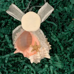 Island Cargo Nautical pink murex Seashell Christmas ornament  with silver hanger, silver bow, a seacookie and a mini brown starfish. Hand Crafted in the USA