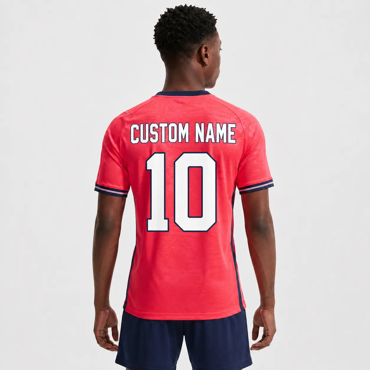 British-Inspired Coral Soccer Jersey – Custom Name and Number Unisex Football Shirt with Tonal Graphic Pattern, Navy Trim, Short Sleeve Personalized Match Day Fan Top for Training, Sports Events, Casual Wear and Gifts