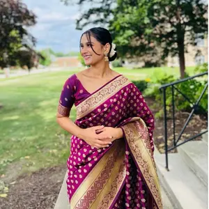 Elegant Magenta Banarasi Saree  Stunning magenta saree featuring rich gold zari buti work and a detailed traditional border. The luxurious pallu adds a royal touch, perfect for weddings, festive events, and special occasions. Timeless, graceful, and eye-