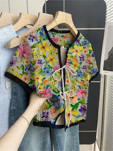 Women's khaki bohemian vacation short-sleeve knit top. Loose round neck, contrast all-over floral print, front tie and contrast piping. Comfortable for spring & summer casual wear. Casual Classy Top